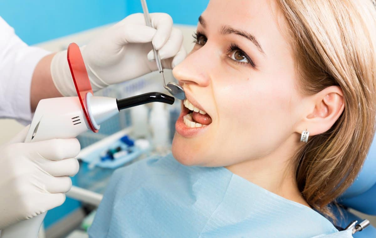 the reception was at the female dentist doctor examines the oral cavity on tooth decay