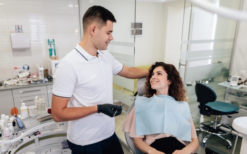 patient dentist smiling each other