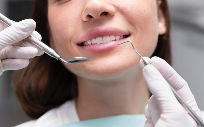 woman having teeth cleaning