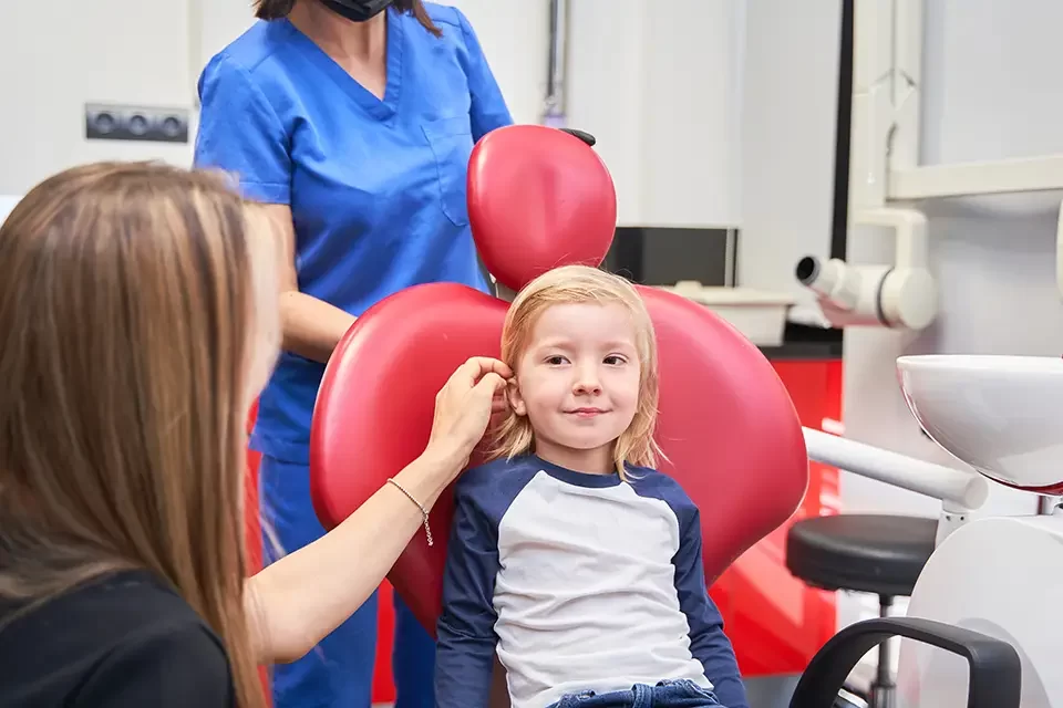 a-young-boy-is-sitting-in-a-dentist-chair